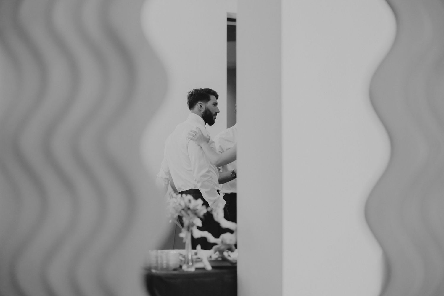 Video still frames show someone stepping forward and performing a swinging motion sequence in grayscale.