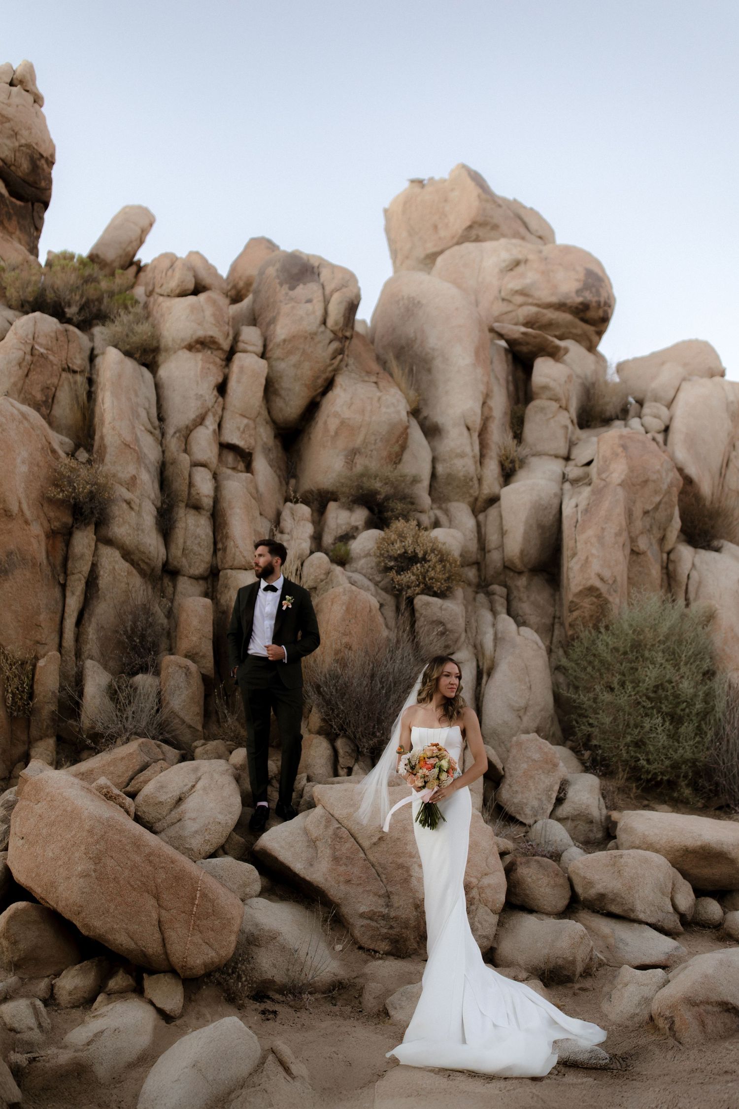 A romantic wedding photoshoot among the dramatic rock formations and boulders of Joshua Tree National Park.