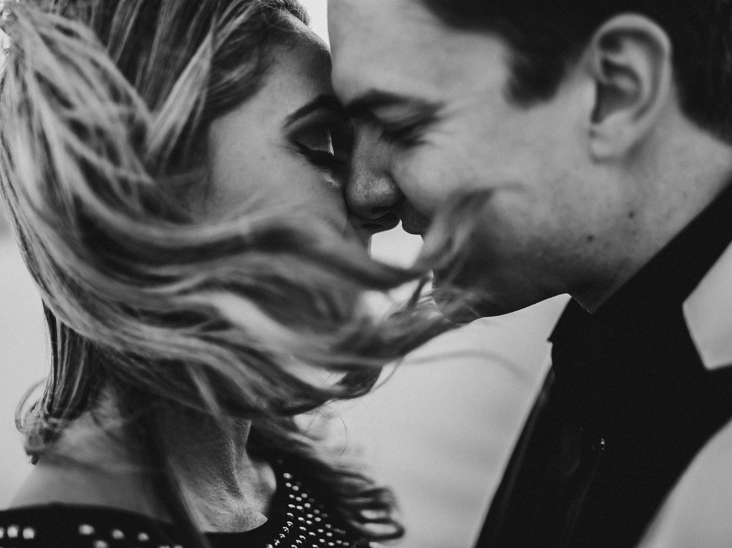 Black and white photo series capturing intimate romantic moments between a couple.