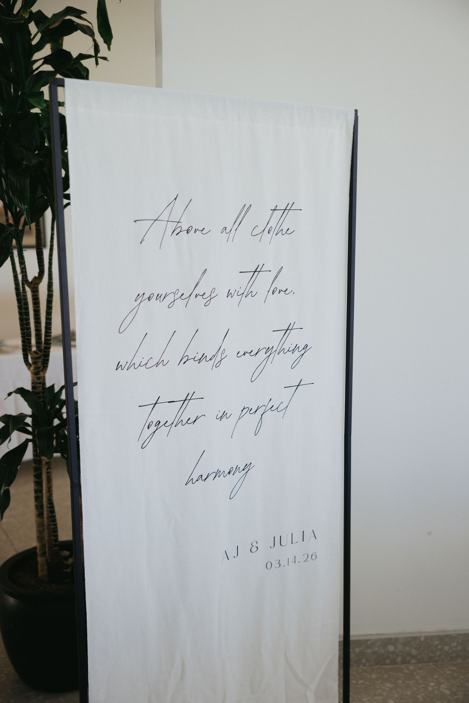 Elegant white wedding banner with cursive script quote and couple names AJ & Julia dated 03.11.20.