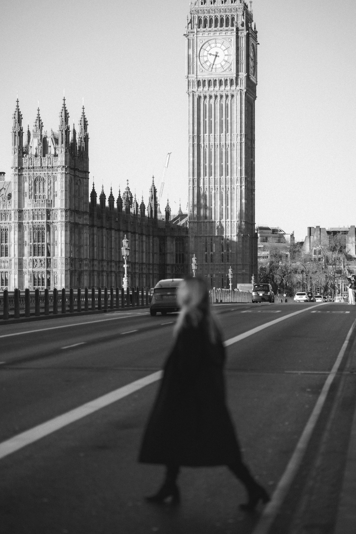 A sequence of black and white photos showing Big Ben and Westminster Bridge in London with a silhouetted figure walking.