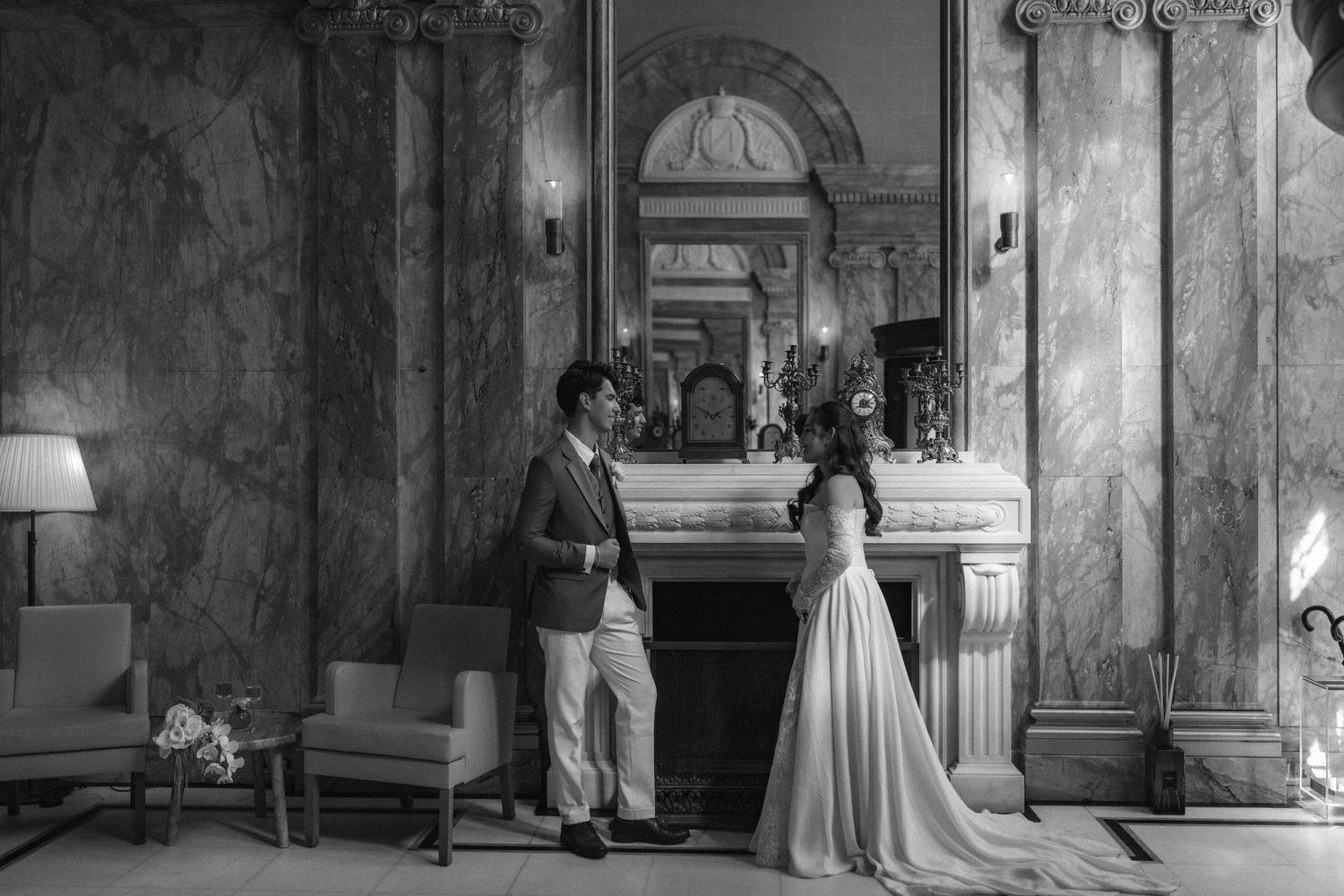 A black and white photo series showing a couple in formal attire posing in an elegant historic interior setting.