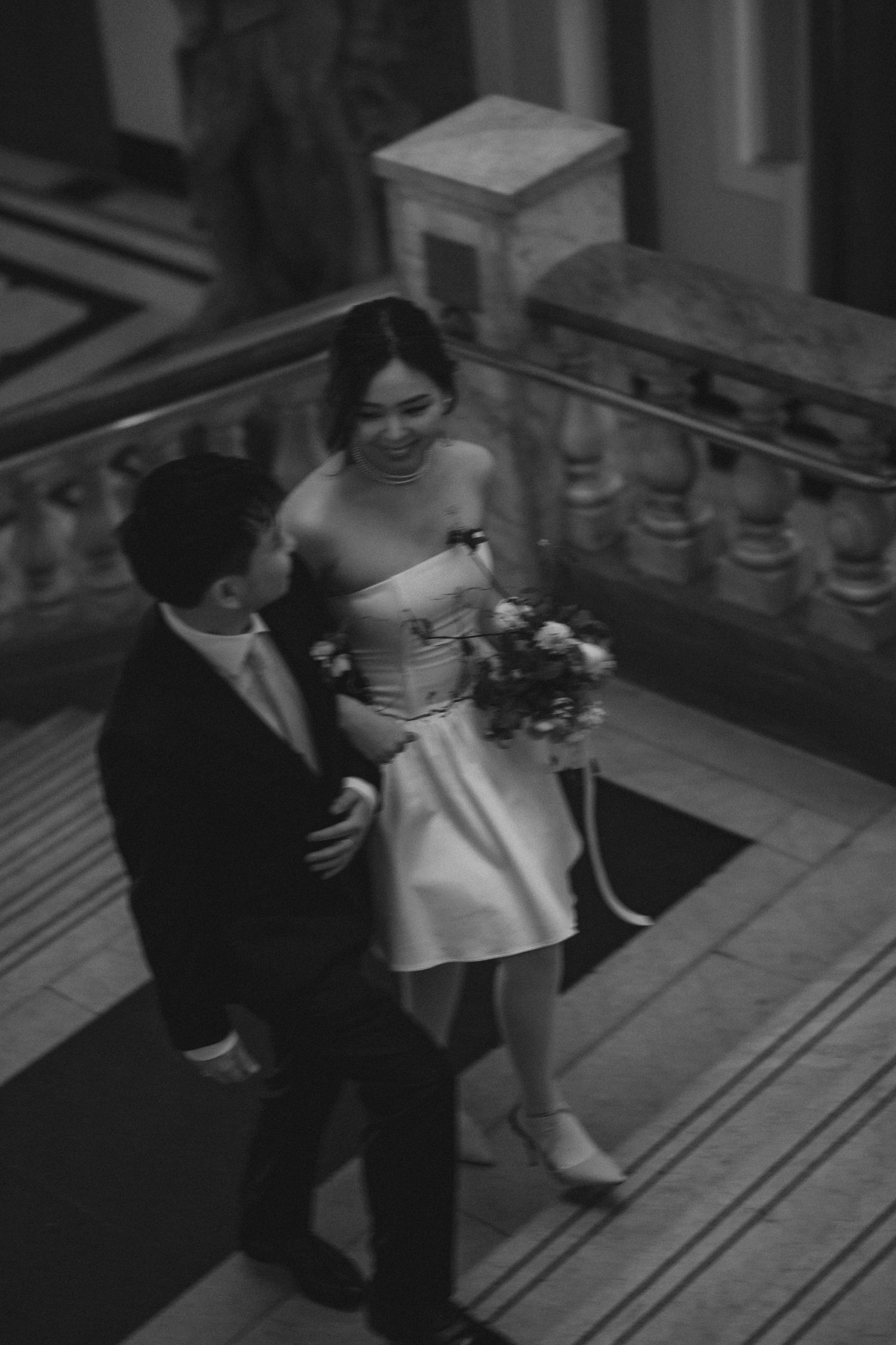 Black and white sequence showing two people dancing together on a porch or deck in a vintage style setting.