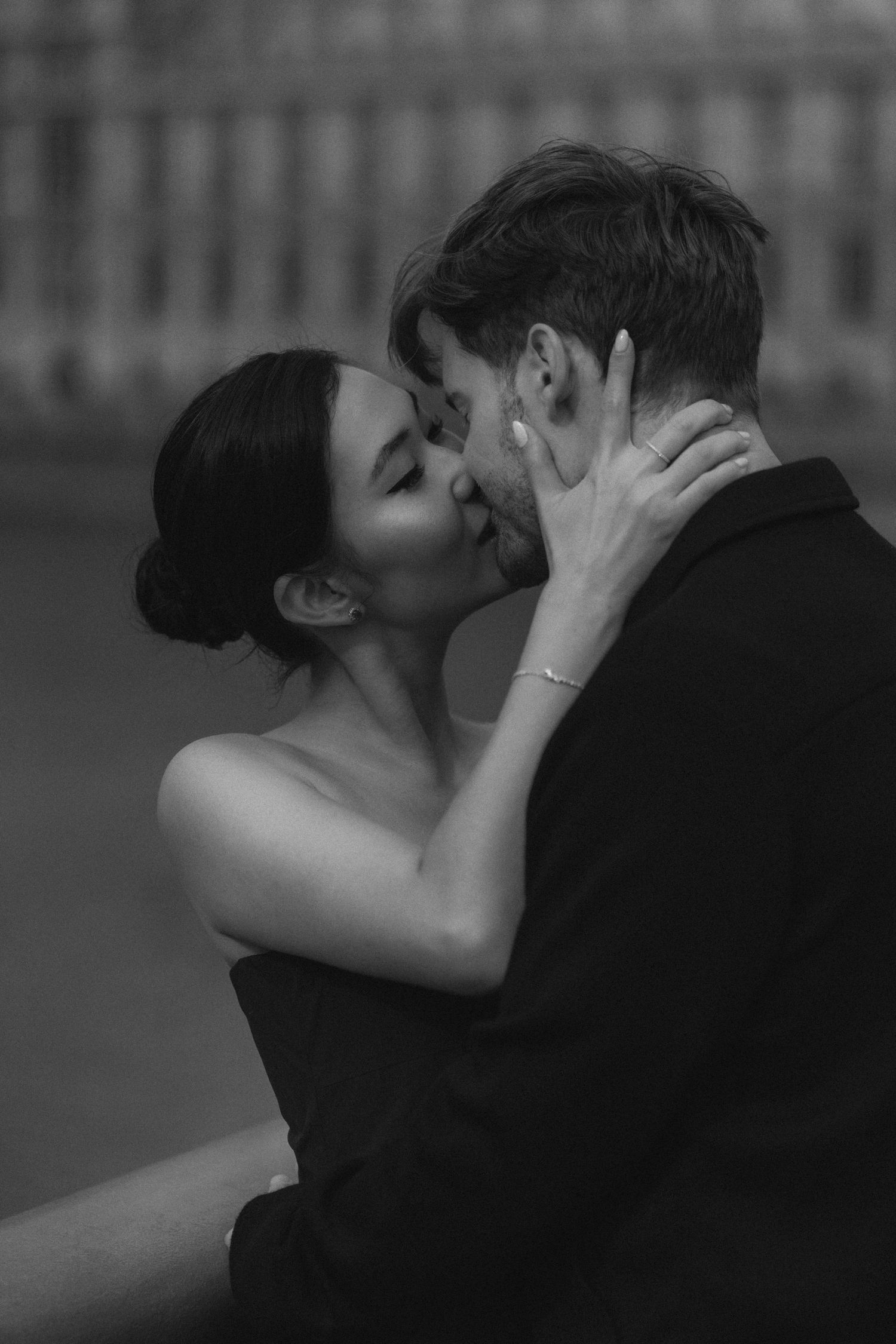 A romantic black and white photo sequence showing a couple embracing and kissing in silhouette.