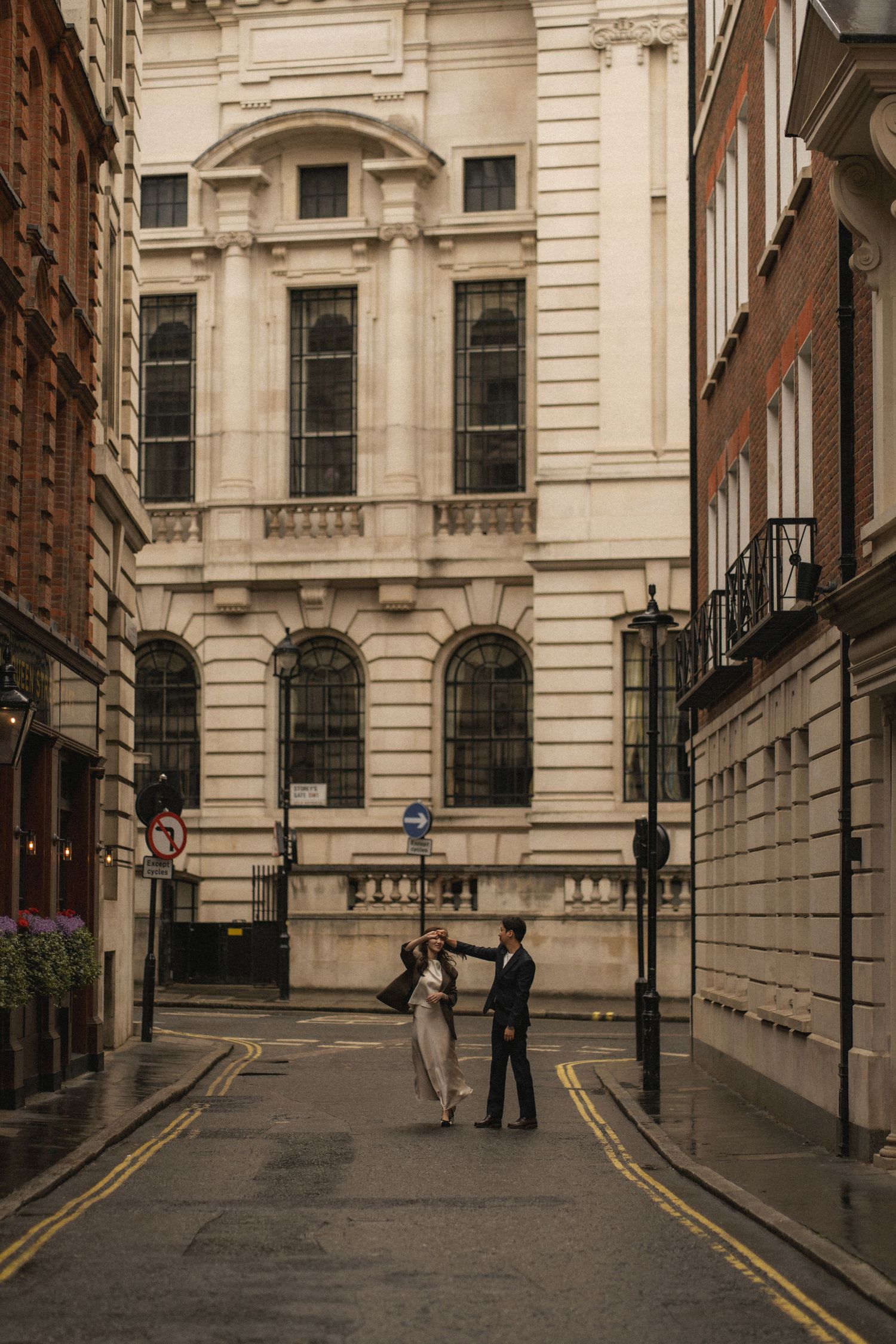 A sequence of five connected urban street scenes showing a narrow alley between classic stone buildings in London.