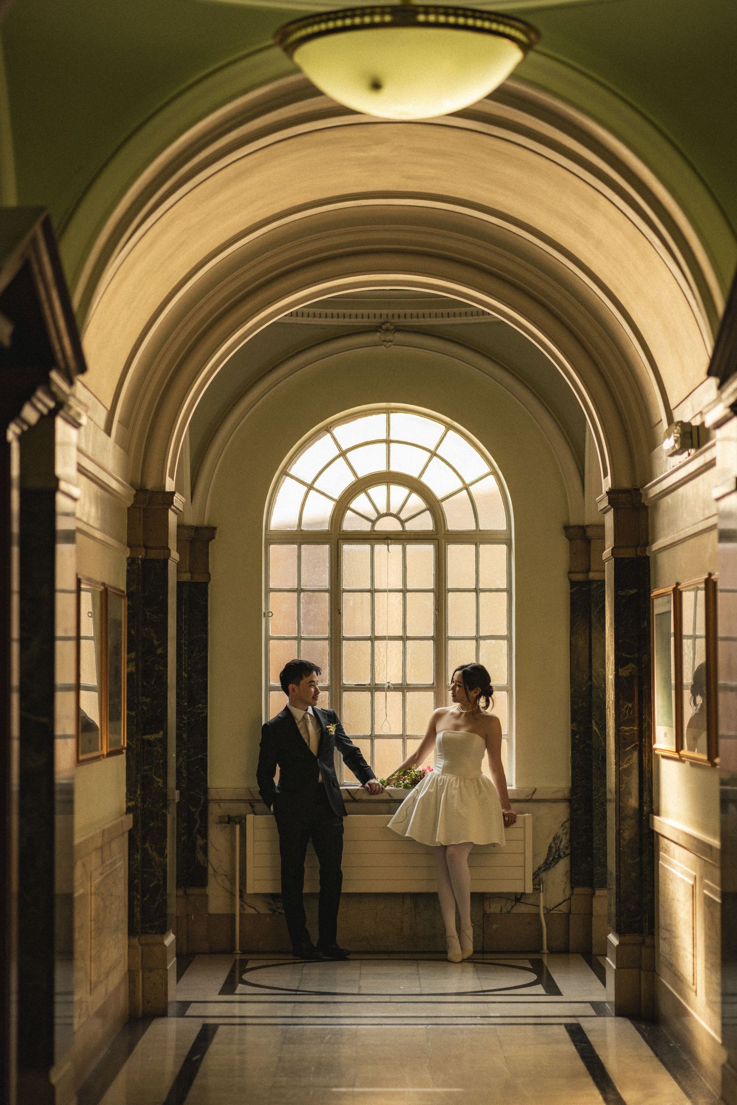 A series of arched hallway photos showing dramatic lighting through a large window at the end of a historic corridor.