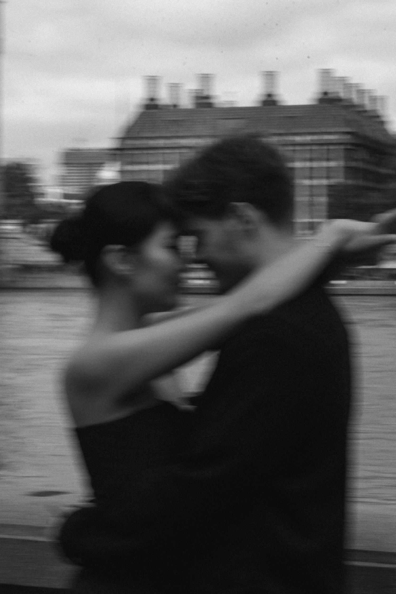 A sequence of black and white photos showing two figures engaged in a dance move with one dipping the other.