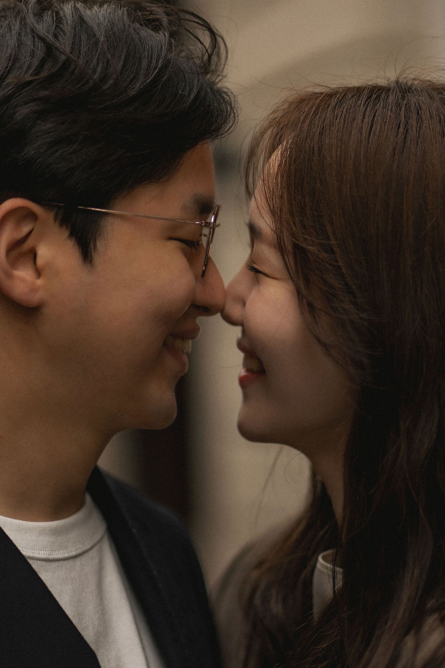 A romantic sequence of five photos showing a couple in an intimate close-up moment together.