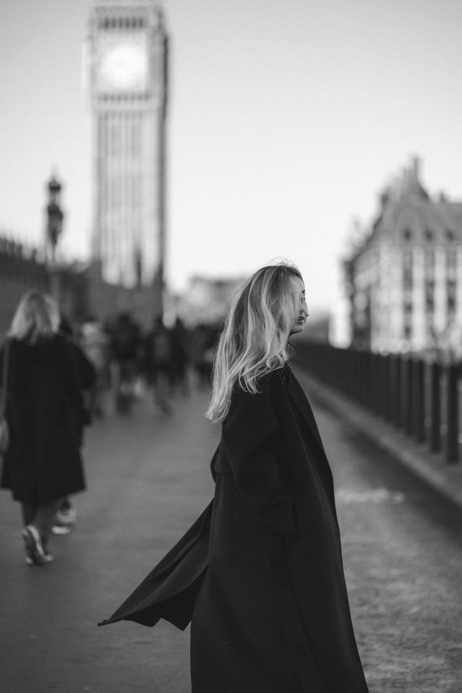 A series of black and white photos showing a person walking along Westminster Bridge with Big Ben in the background.