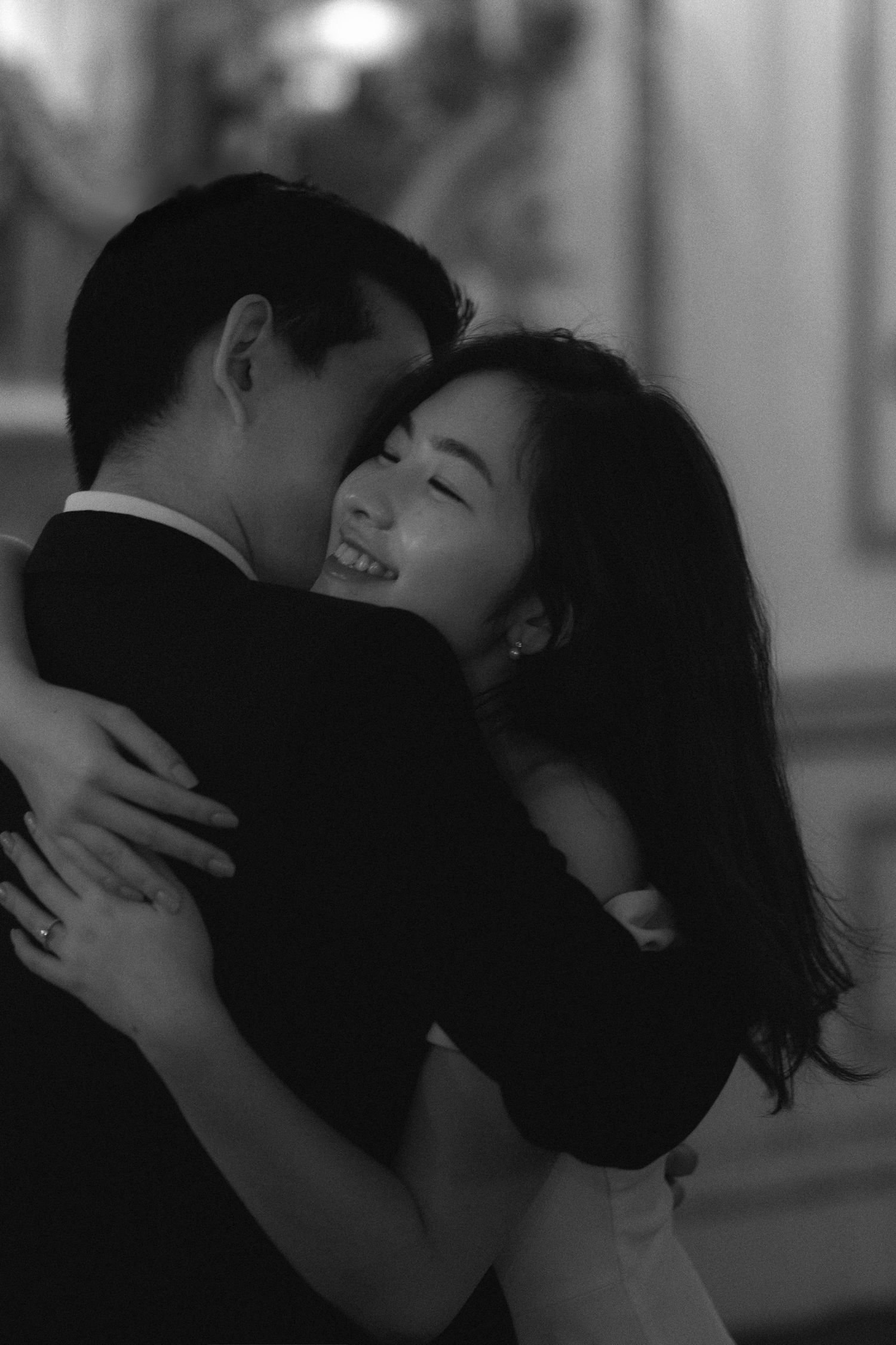 A series of black and white romantic photographs showing couples embracing and kissing in an intimate sequence.