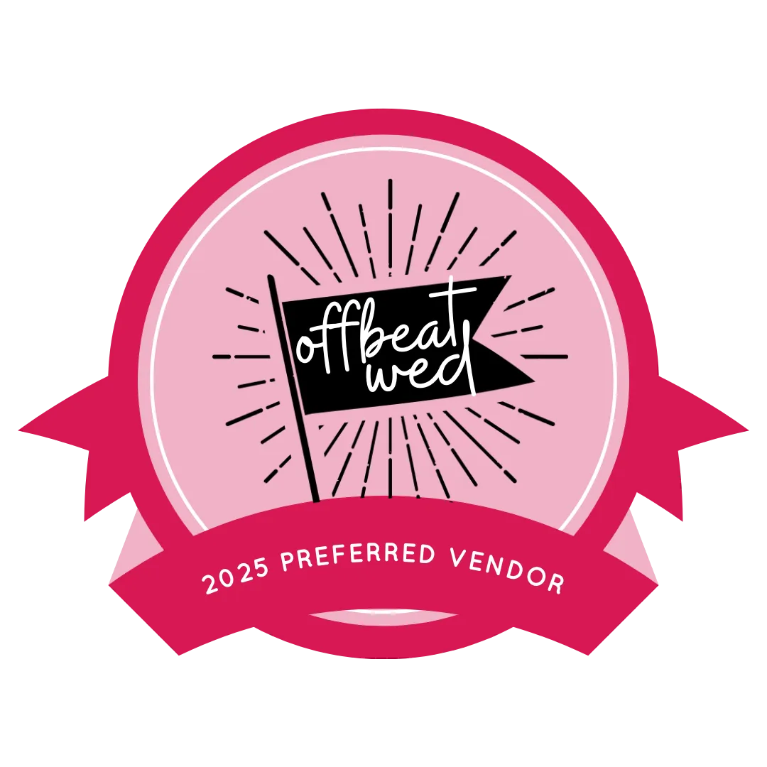 A pink circular badge with 
