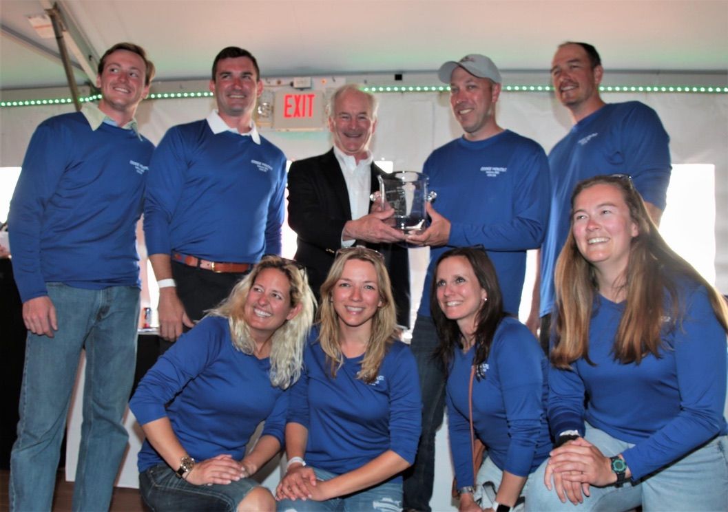 Athena Arnold marine lifestyle and event photographer accepting award for Annapolis to Newport Race.