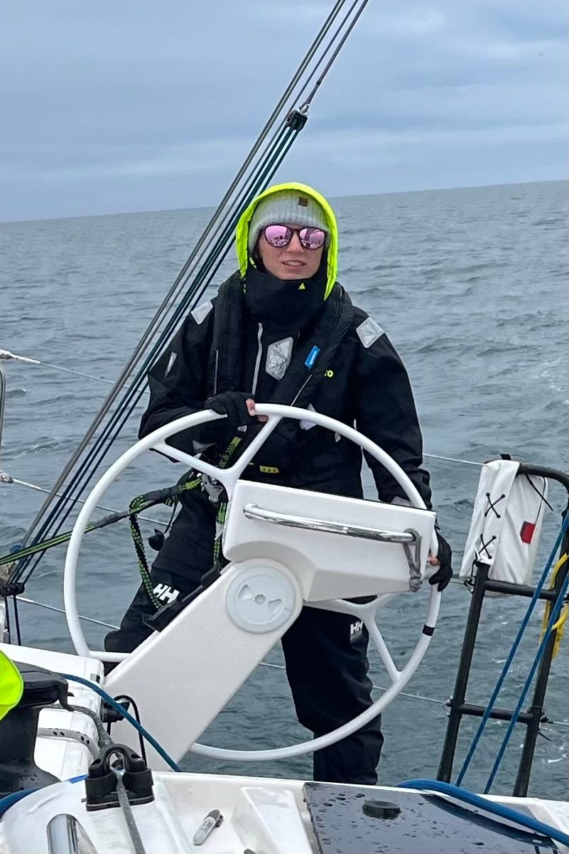 Florida travel and adventure photographer Athena Arnold sailing in the Atlantic ocean.