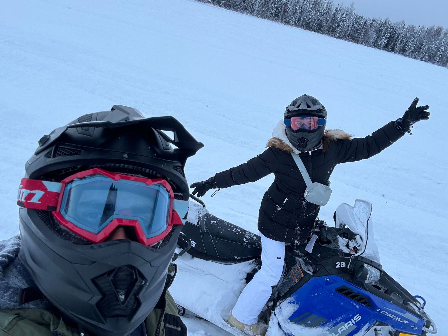 Travel photographer Athena Arnold riding snowmobiles in Alaska.