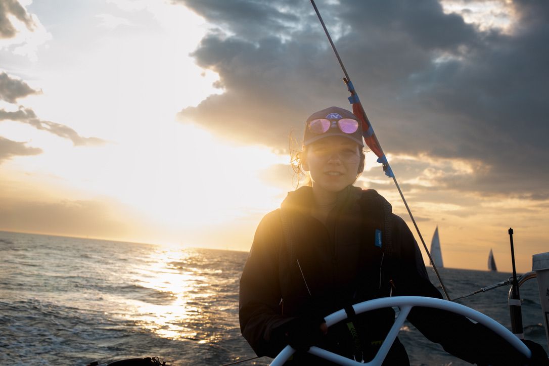 Maryland adventure photographer Athena Arnold skippers sailboat down Chesapeake Bay.