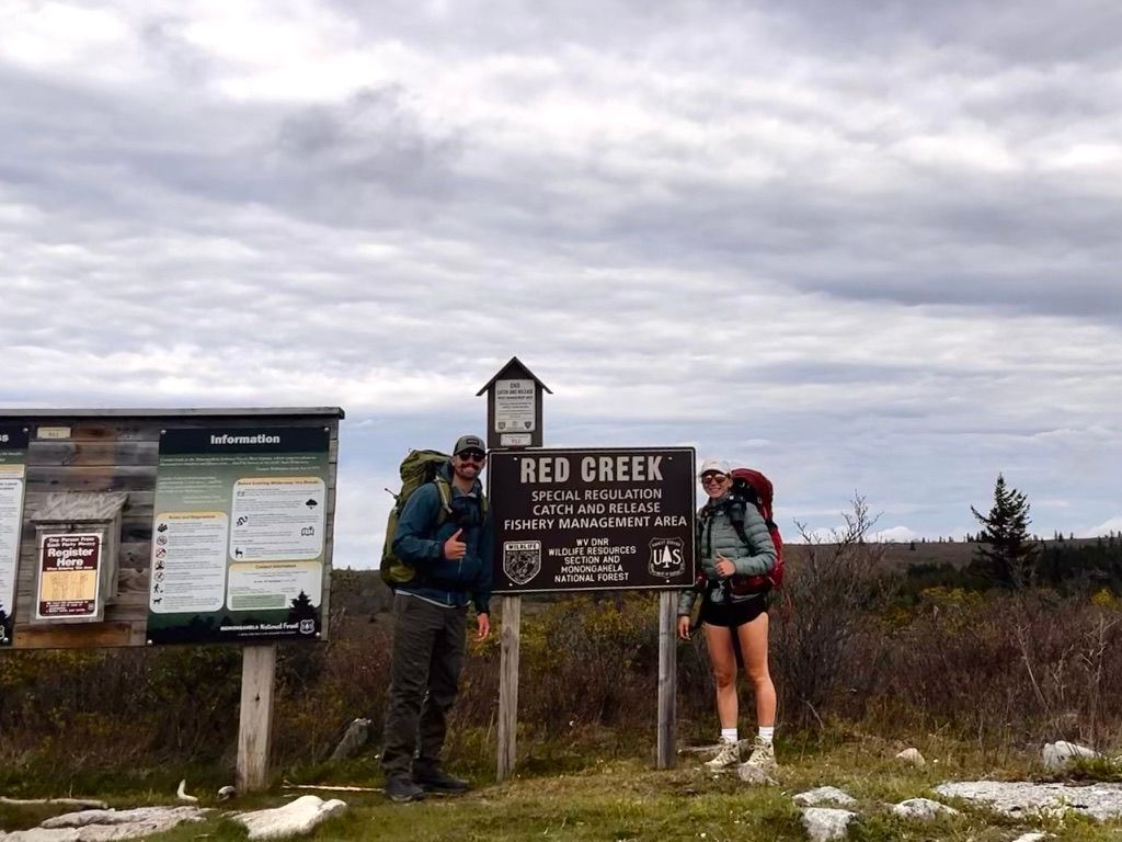 Adventure couples photographer Athena Arnold hiking in West Virginia Dolly Sods.