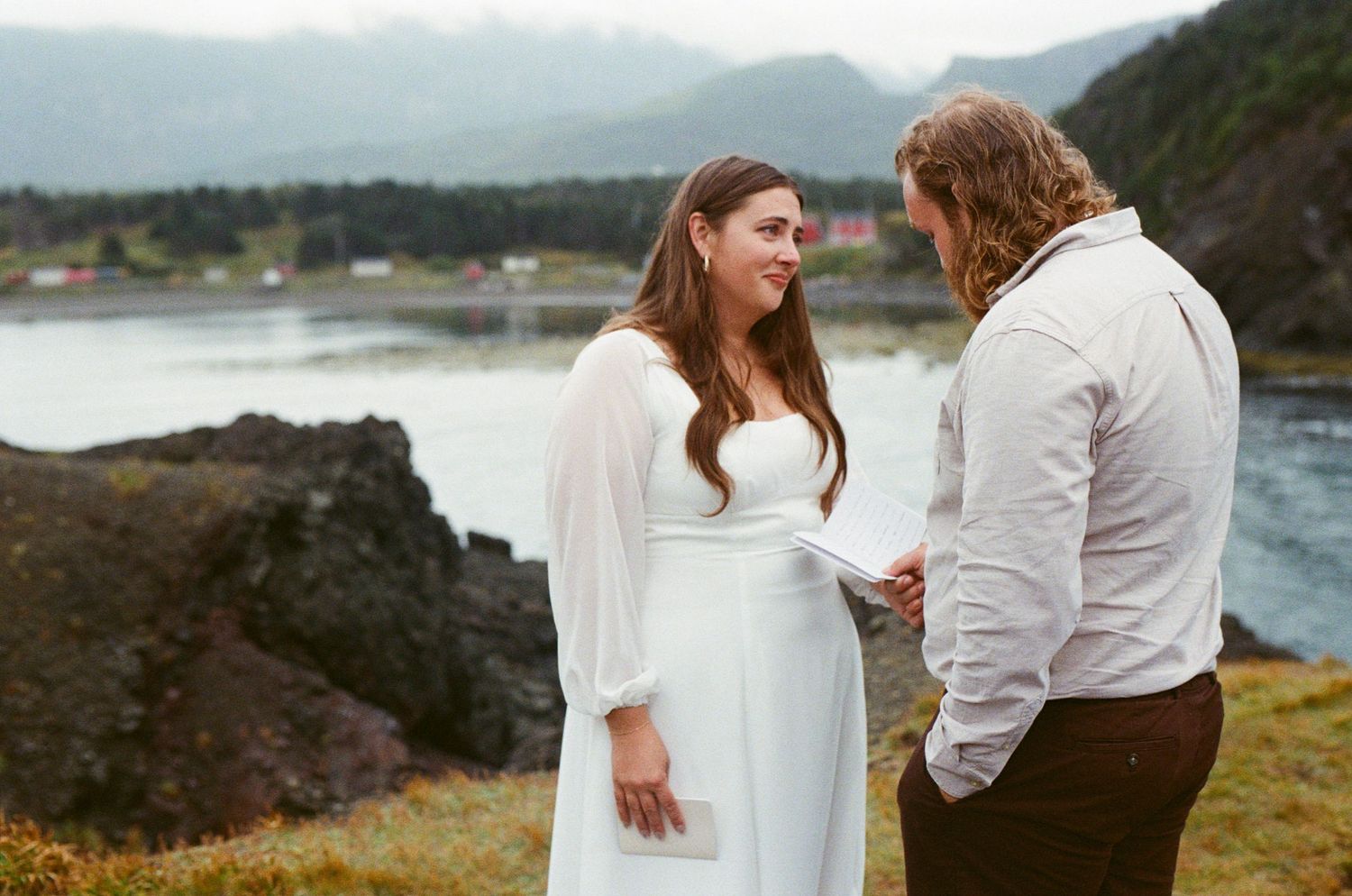 35 mm film photo of bride's eyes filling with tears as groom reads his vows on the Vancouver Island coast