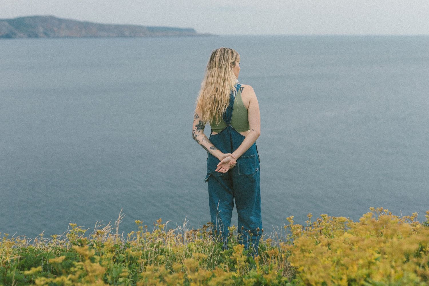 35 mm film photo of a woman in a wildflower meadow