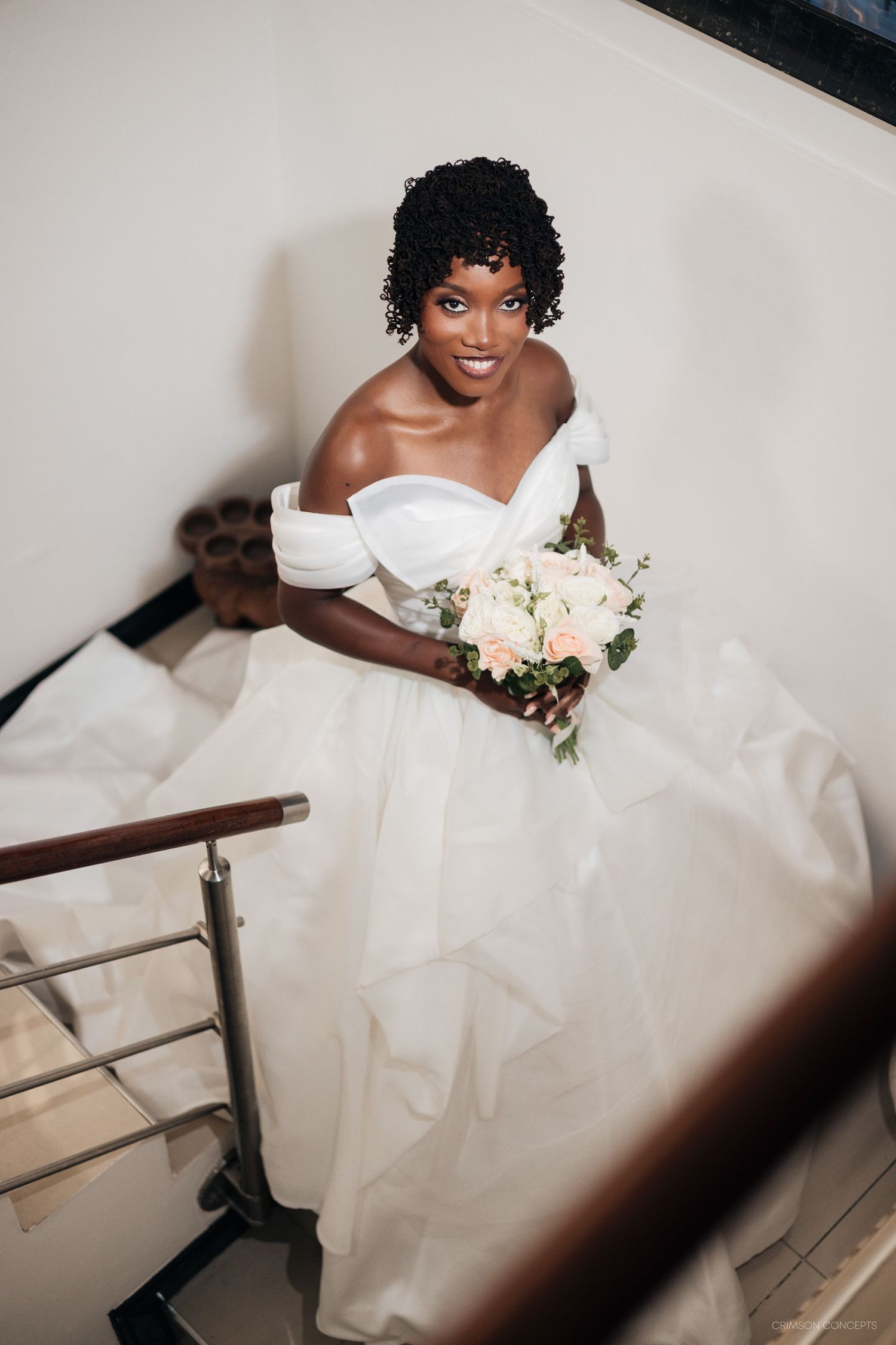 Bride smiling moments before walking down the aisle