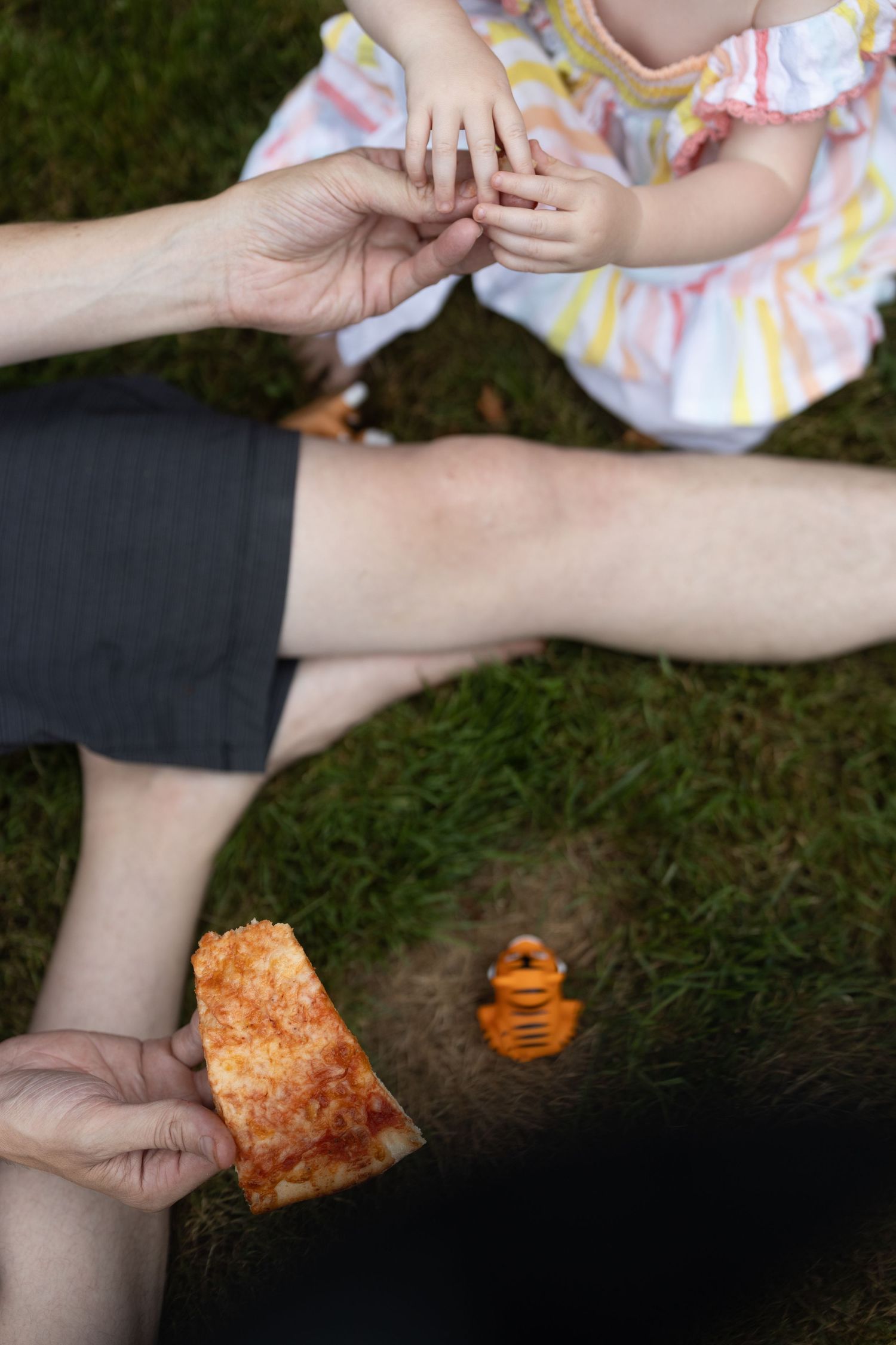 Candid portrait of child eating pizza. Zoomed in composition.