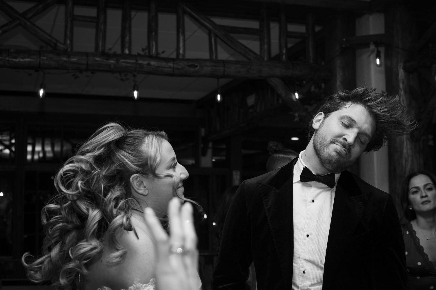A black and white film strip showing multiple candid moments at what appears to be a social gathering or party.