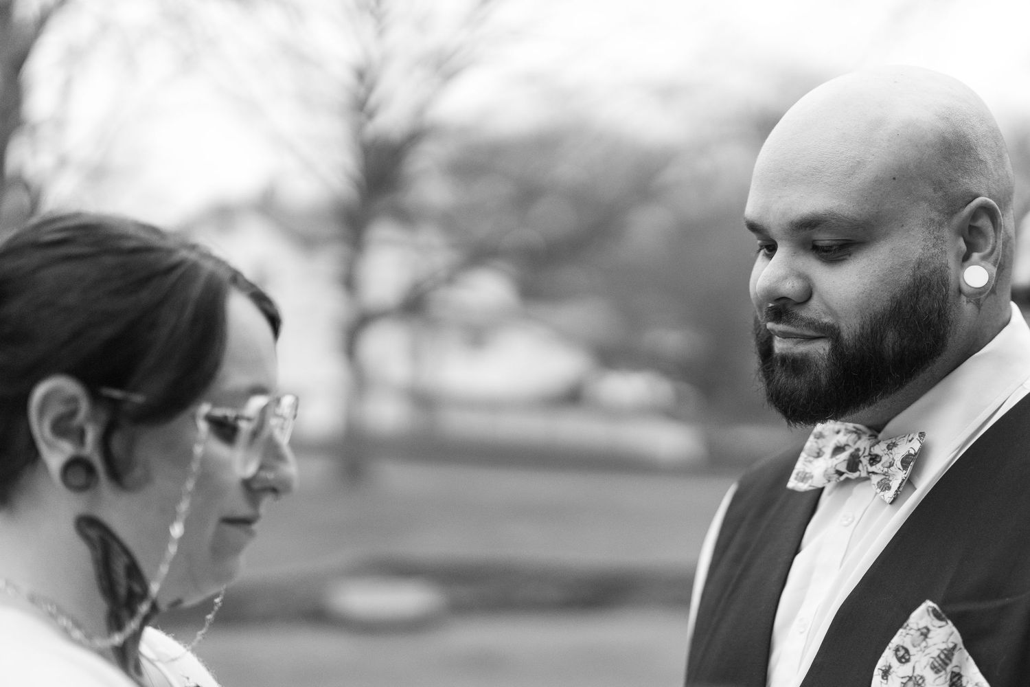 A black and white candid moment captured between after bride and groom's ceremony. Artistic  portait.