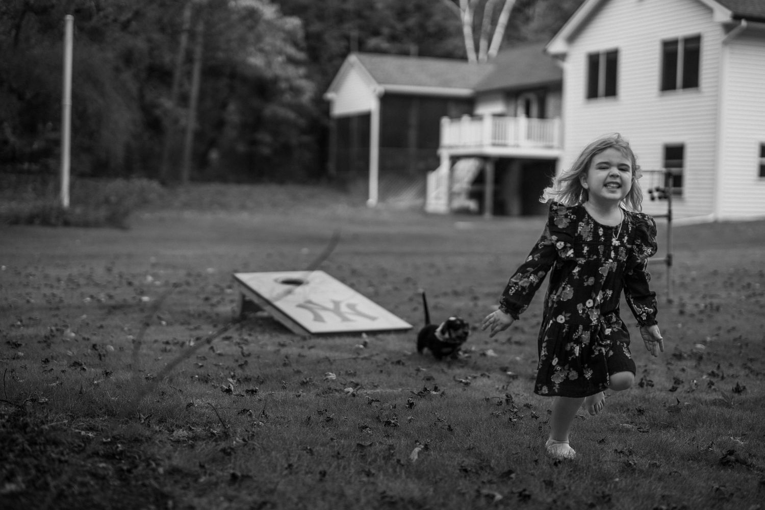 Black and White portrait of  a Child Running, Artistic Motion Blur. Not Posed. Not Stiff. Artistic Portrait.