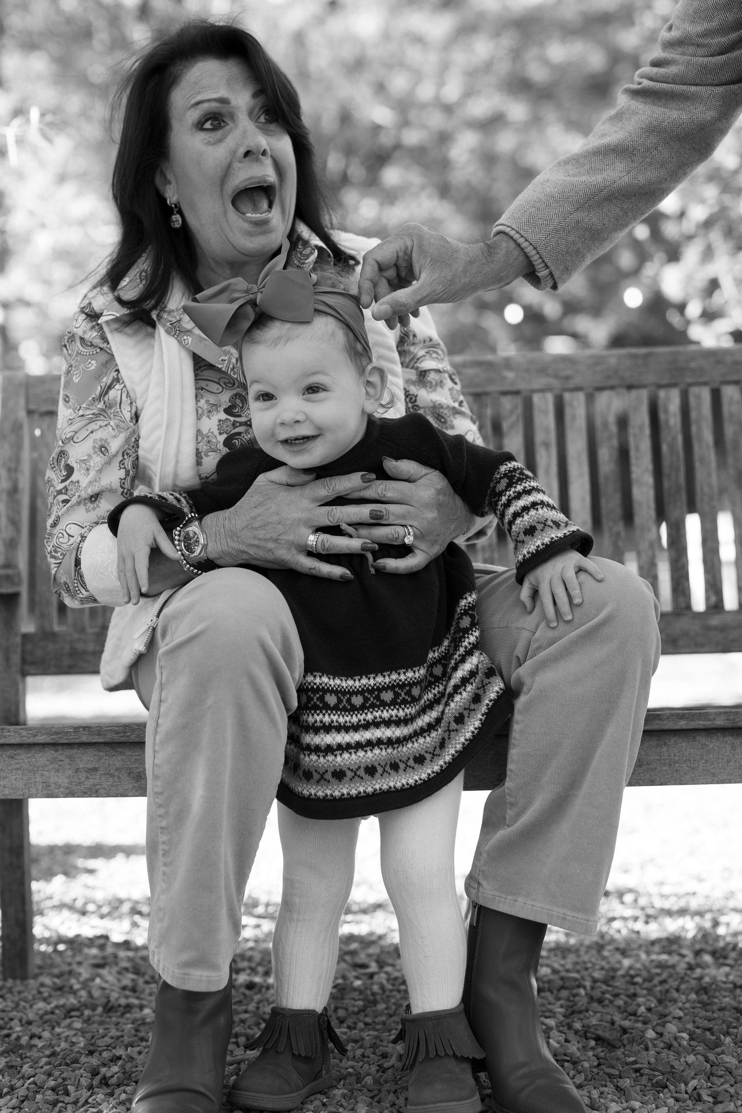 Funny Candid Family Portrait of a grandma Laughing. Black and white Documentary Style Portrait.