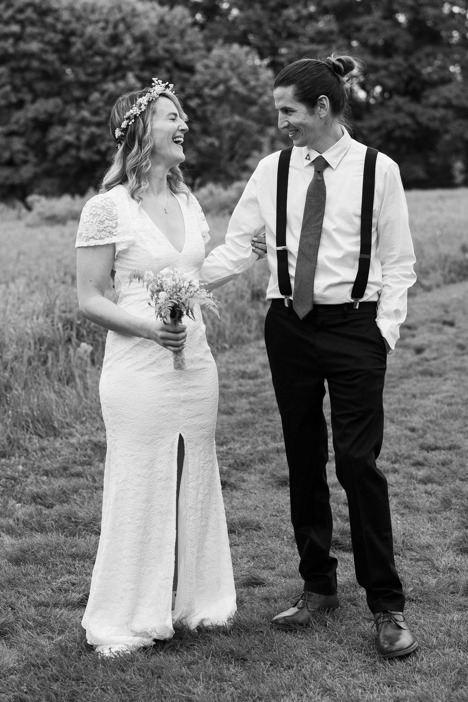 Black and white candid wedding photos showing joyful moments between newlyweds in an outdoor field setting. Bethel Connecticut. Elopement.