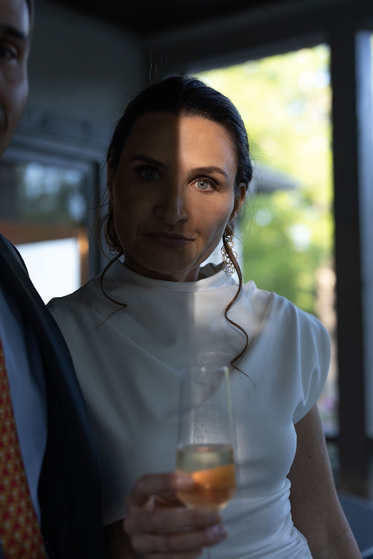 wedding portrait of a bride in low direct lighting. artistic portrait.
