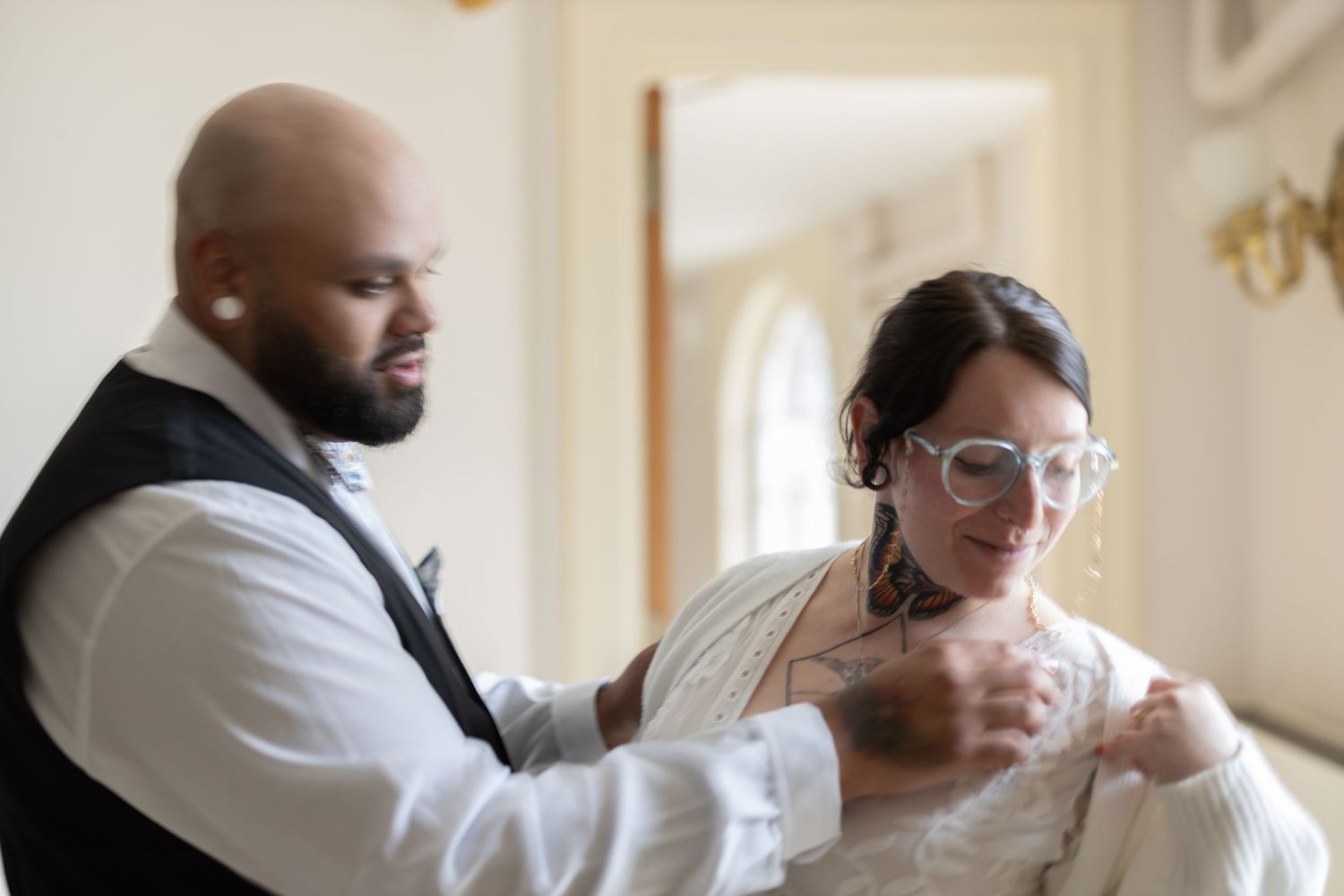 A wedding photographer captures candid moments between the bride and groom during their special day.