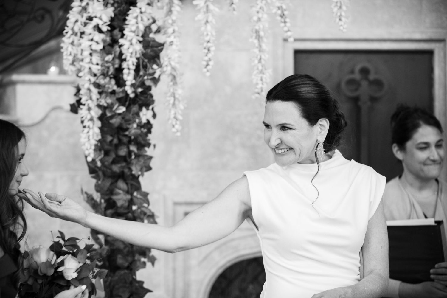 Black and white photo series showing a couple dancing and celebrating at a wedding reception.
