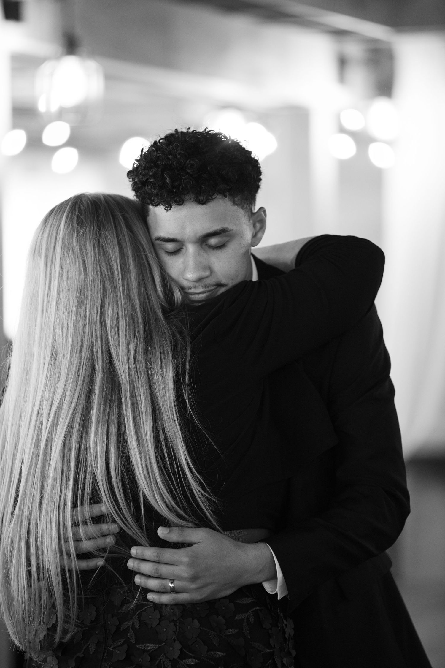 Black and white Portrait of mom and son dancing