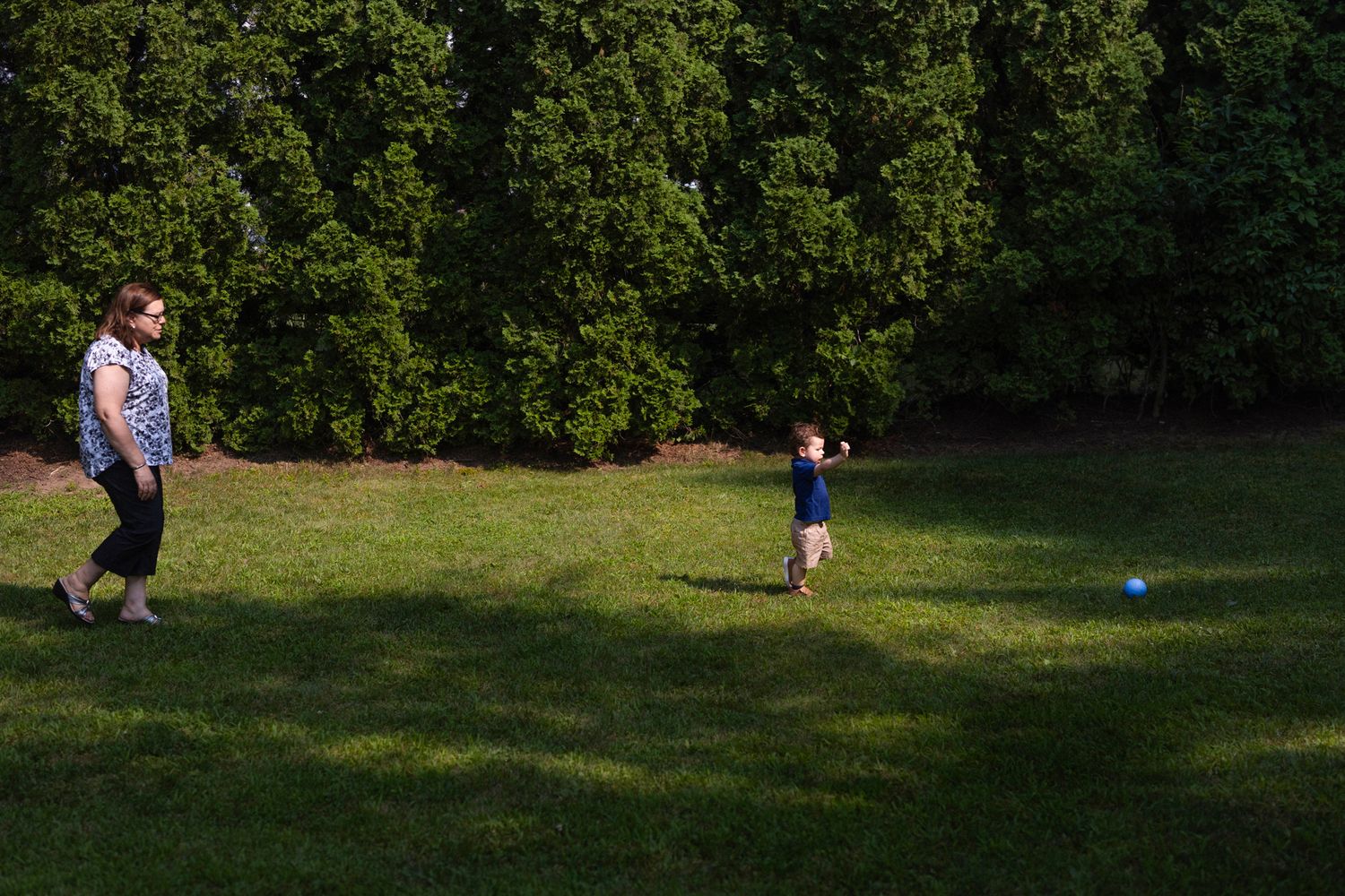 Grandma chasing child outside. Monroe Connecticut.