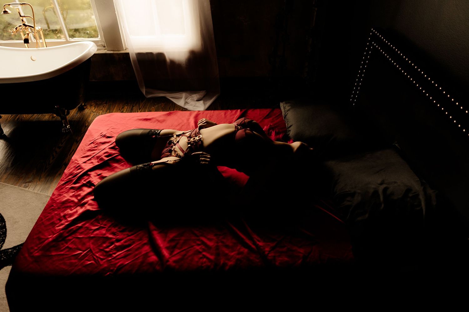 Studio boudoir portrait with moody lighting