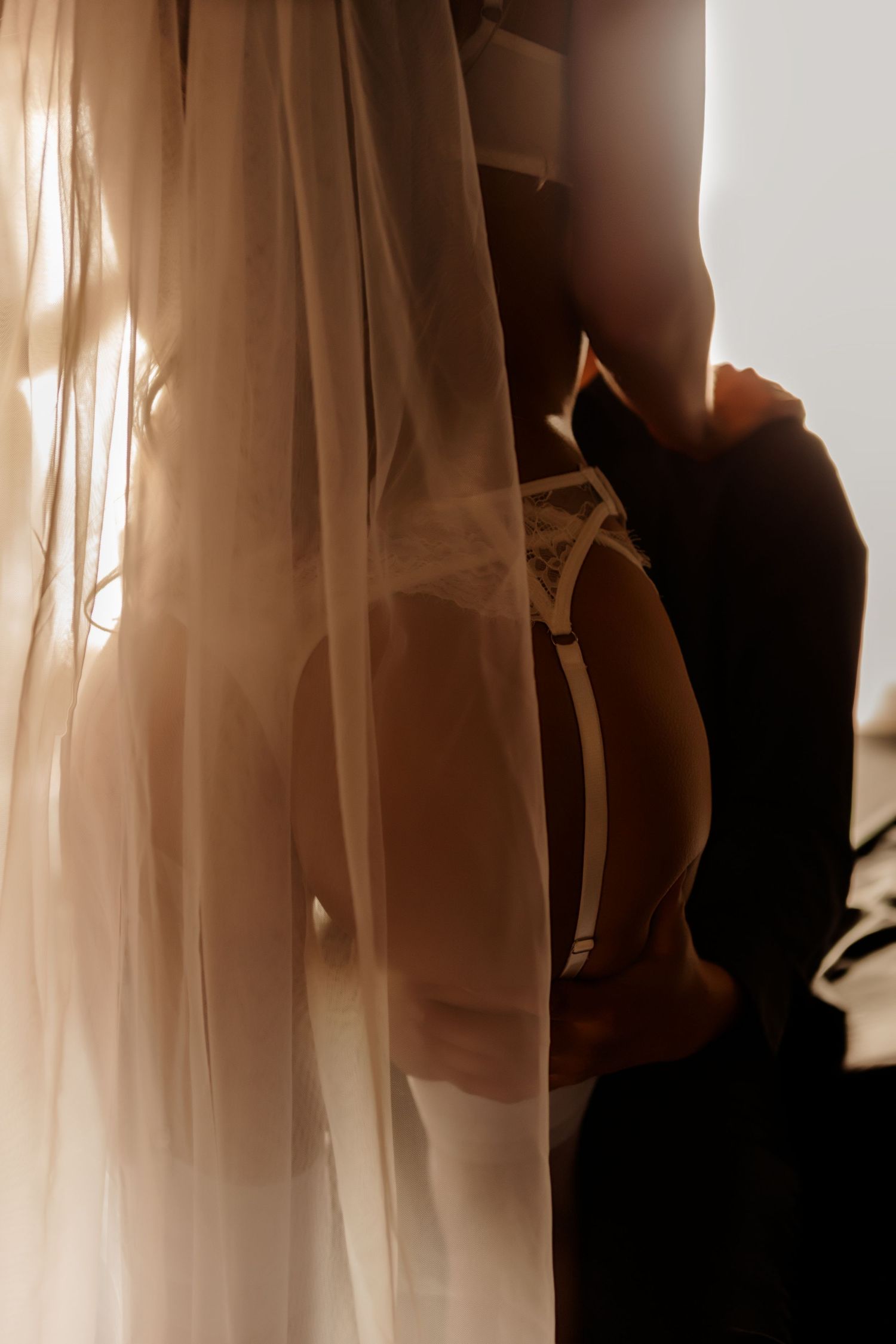 Studio boudoir portrait with moody lighting