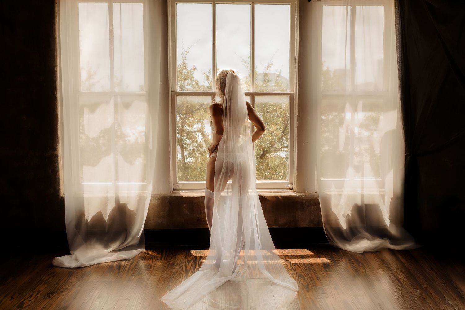 Studio bridal boudoir portrait with moody lighting