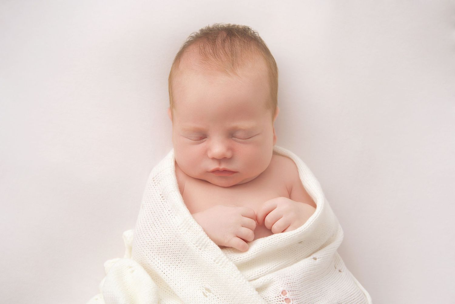 Selection of soft newborn wraps and props used for in-home photography in Wingerworth.