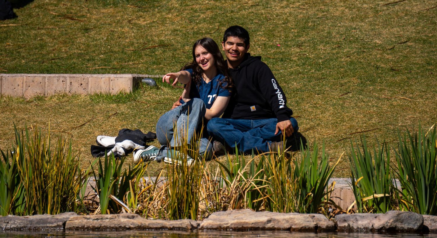 a couple at a pond