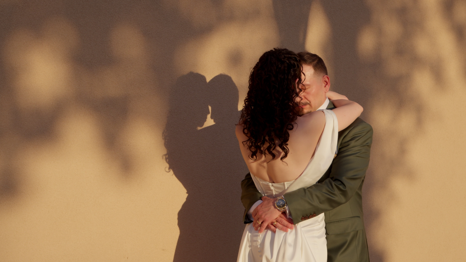 a bride and groom holding each other