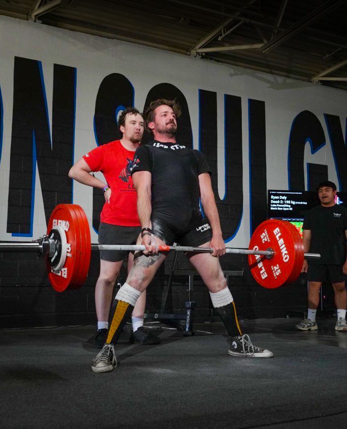 a man deadlifting