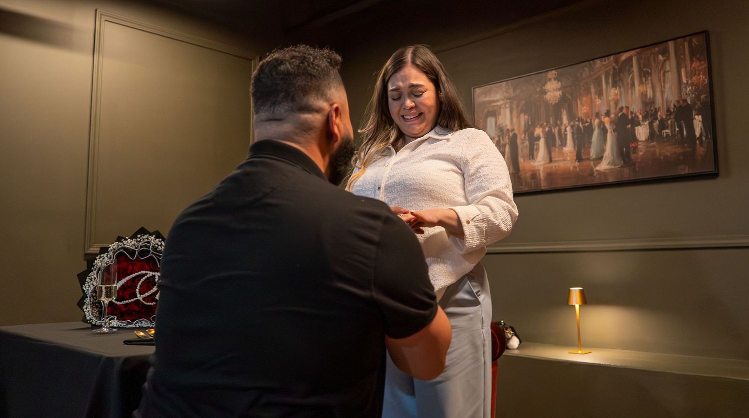 a couple in the middle of a proposal