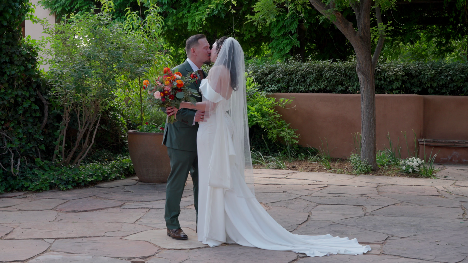 a bride and groom kissing