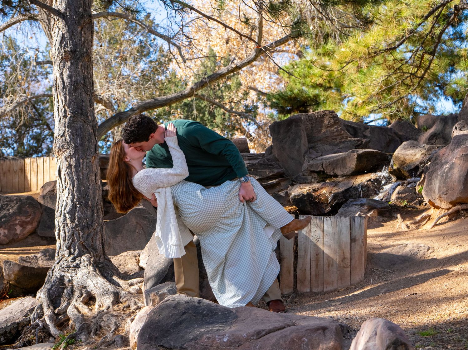 a couple doing a dip and kiss