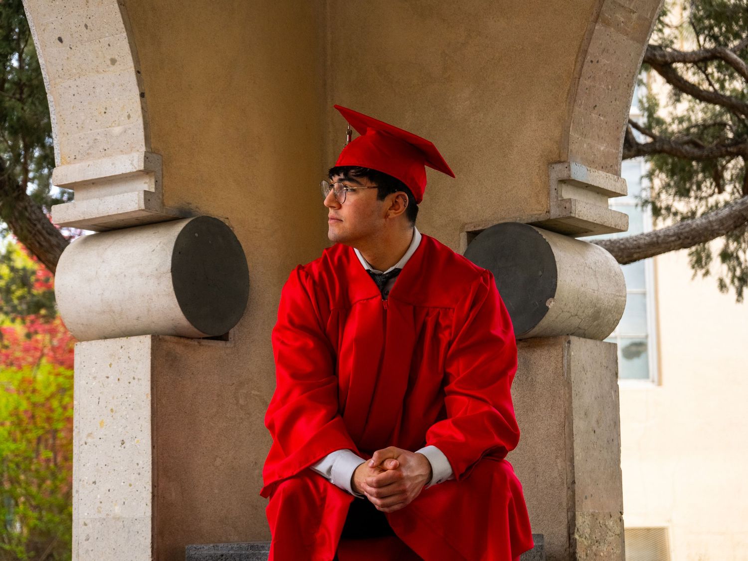 a unm graduate looking to the side