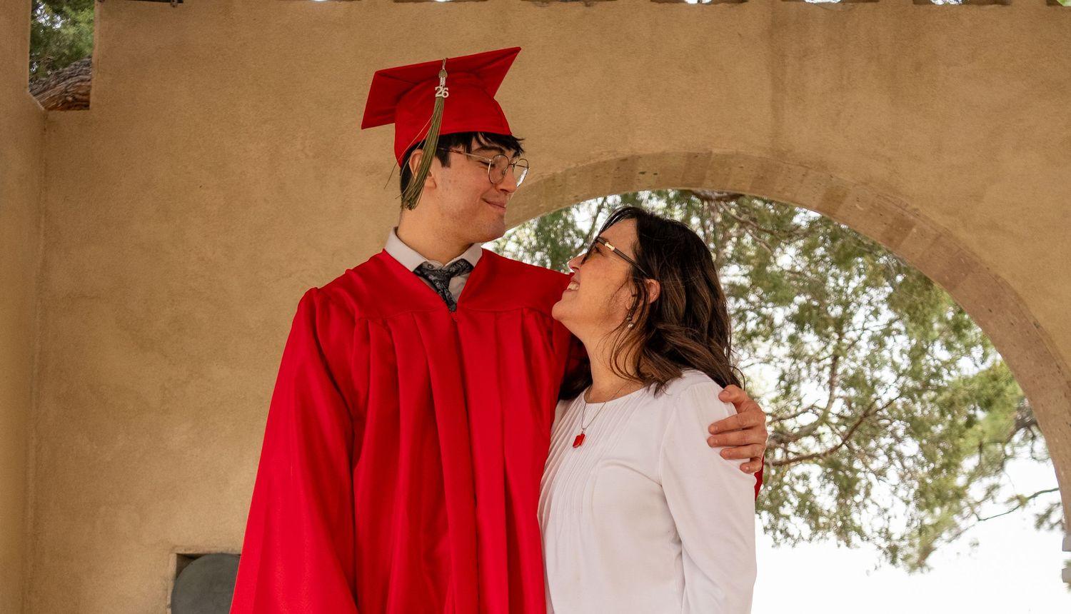 a graduate with his mom