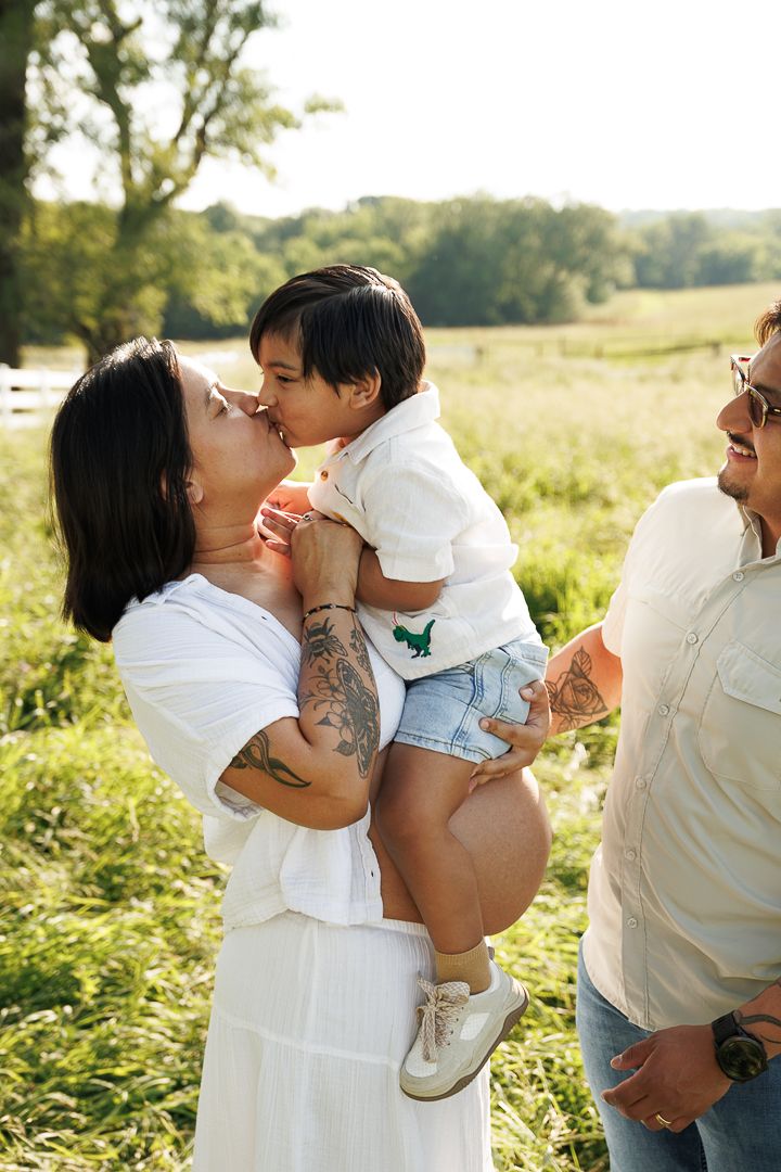 A series of intimate family photos taken outdoors in a sunlit field during golden hour.