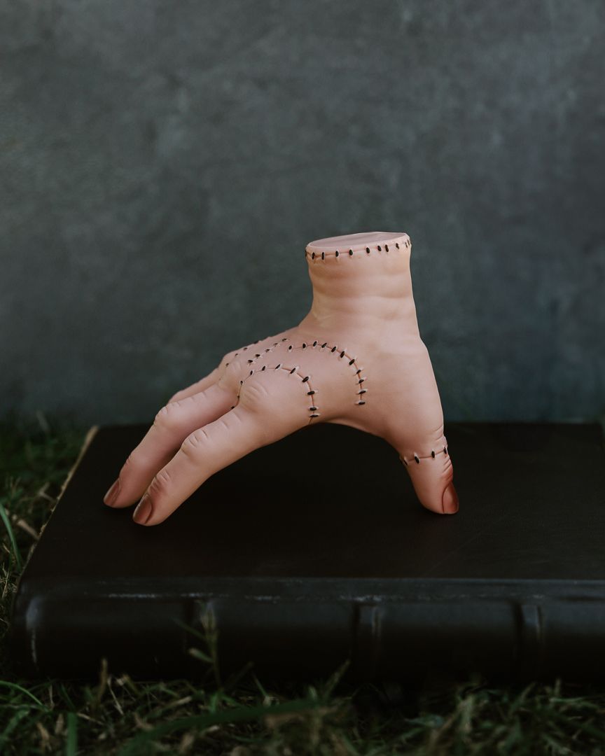 Dotted line drawings and markings on bare feet against a dark background.