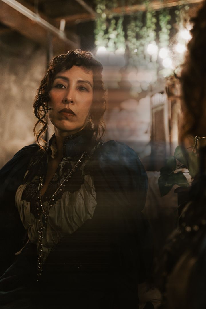 Atmospheric portrait series in dark moody lighting with gothic aesthetic and dramatic shadows.
