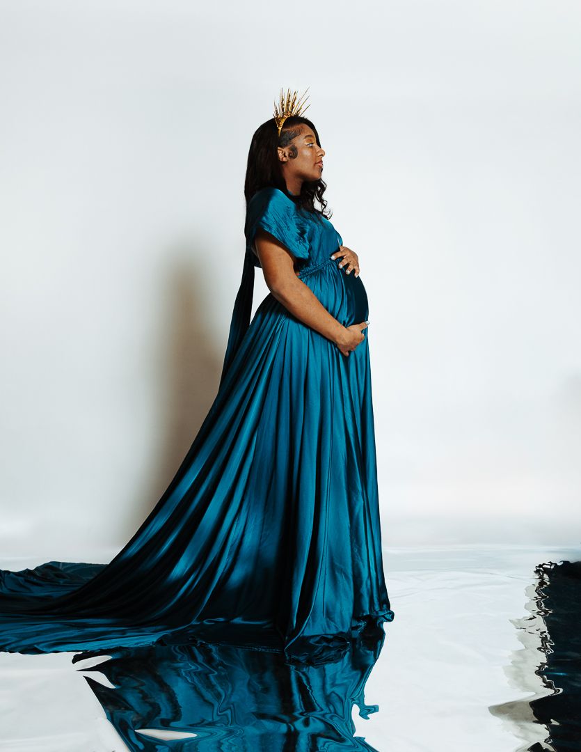 Fashion portrait series in flowing teal dress against white background.